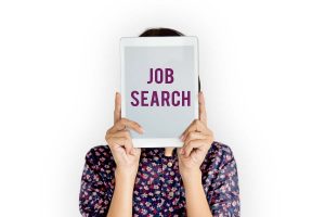 woman holding a job search screen