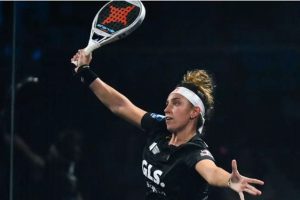 Bea Gonzalez holding a racket and jumping
