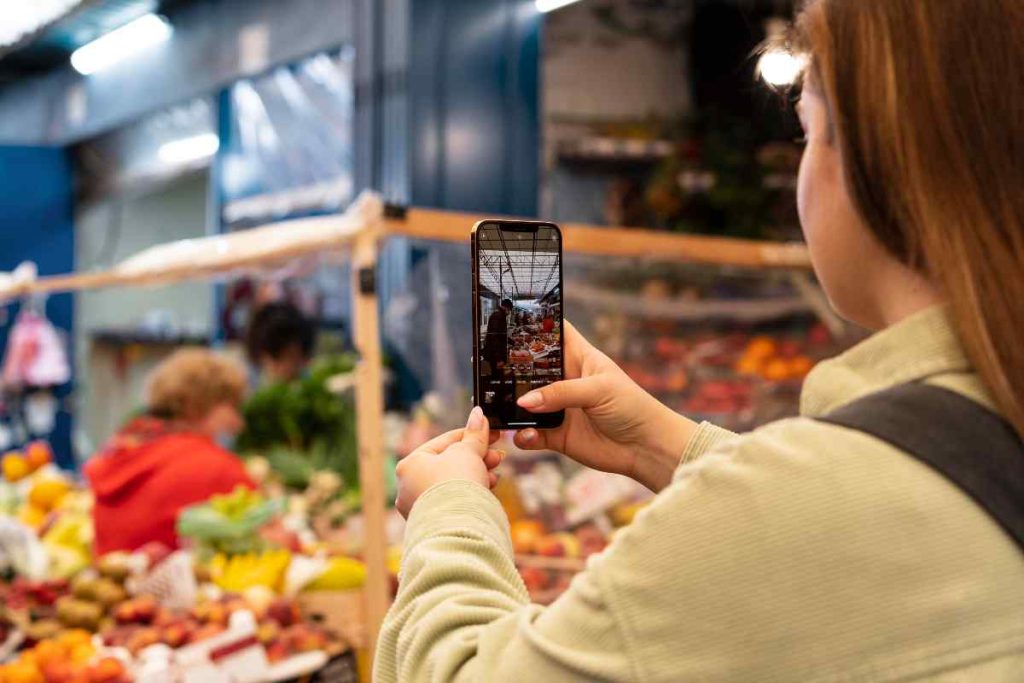 close-up-woman-taking-photos of groceries