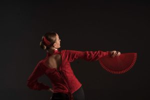 medium-shot-woman-dancing-with-fan